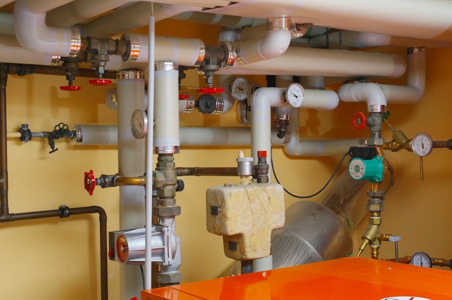Copper pipes and valves in a mechanical room
