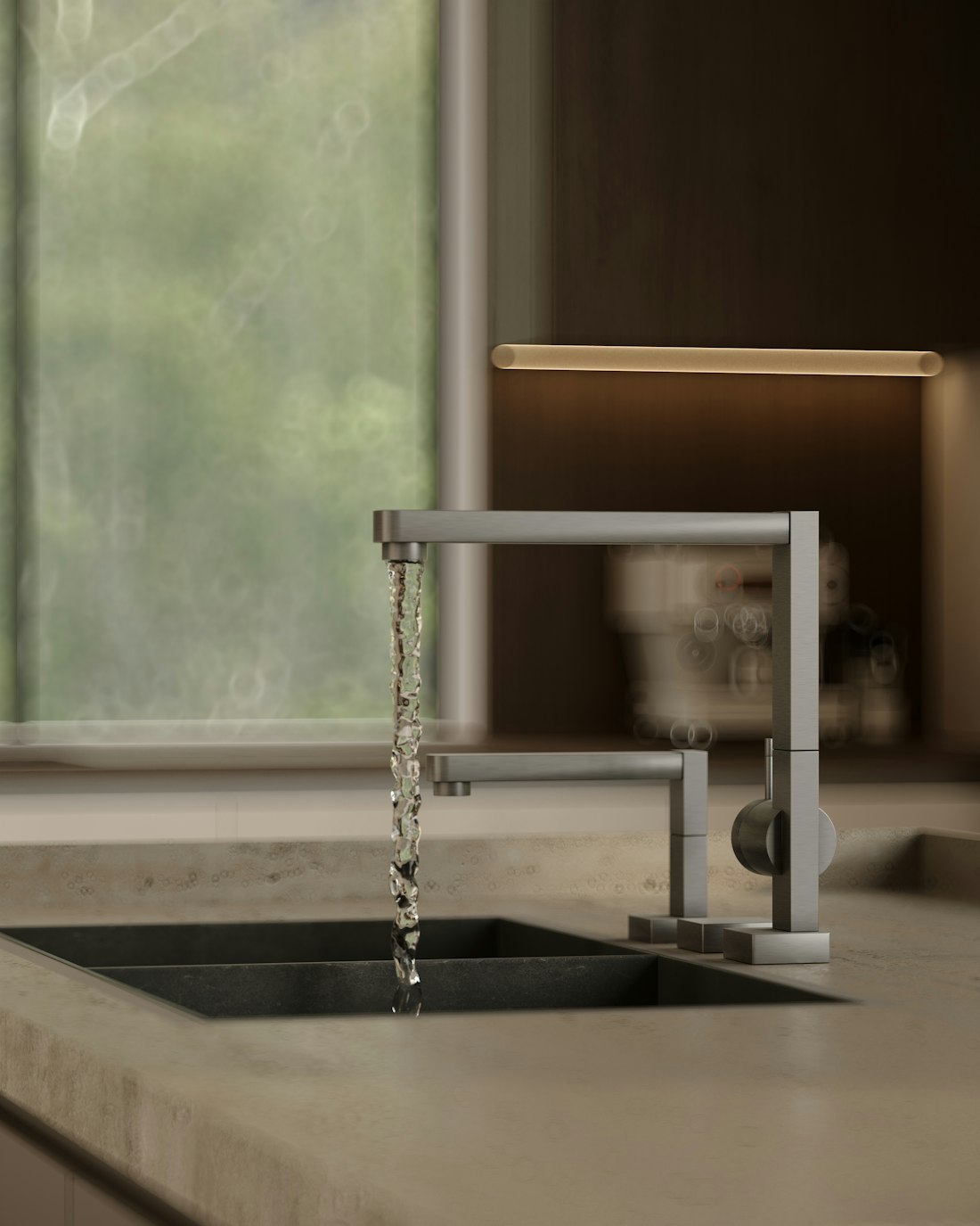 Modern kitchen faucet with water flowing into a sink
